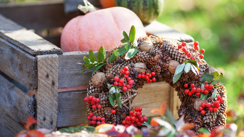 Fall wreath by pumpkin crate