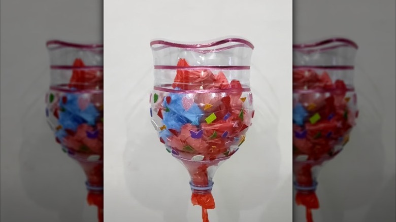 Photo of a plastic bag dispenser made of a water jug