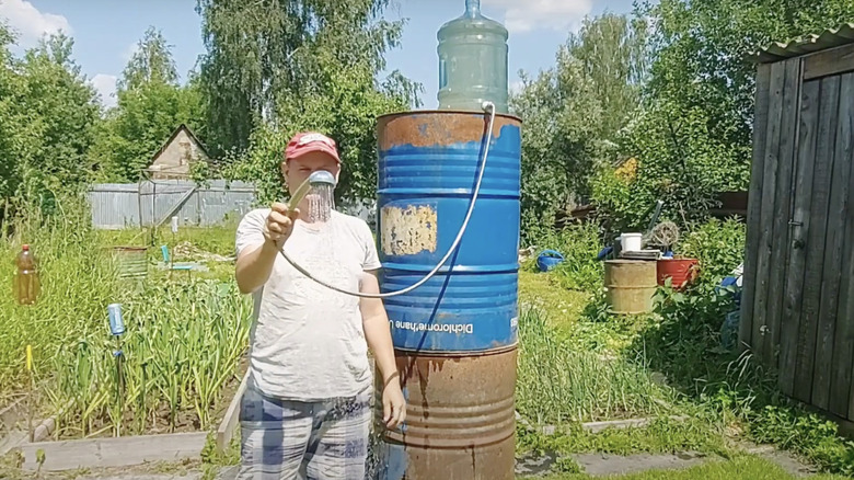 Outdoor shower made of a 5 gallon water jug
