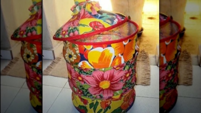 Decorated water jug turned into a trash can