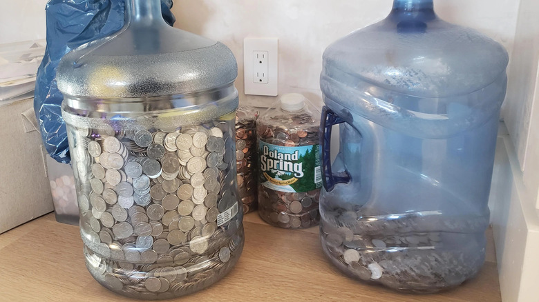 Water jugs filled with coins