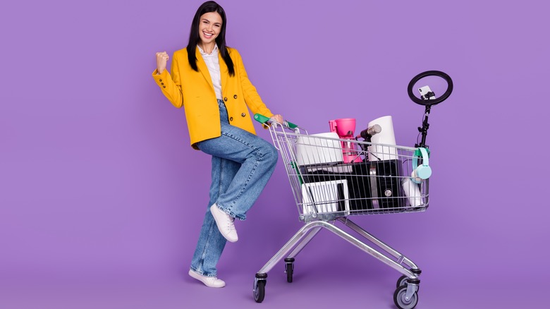 Woman with full shopping cart