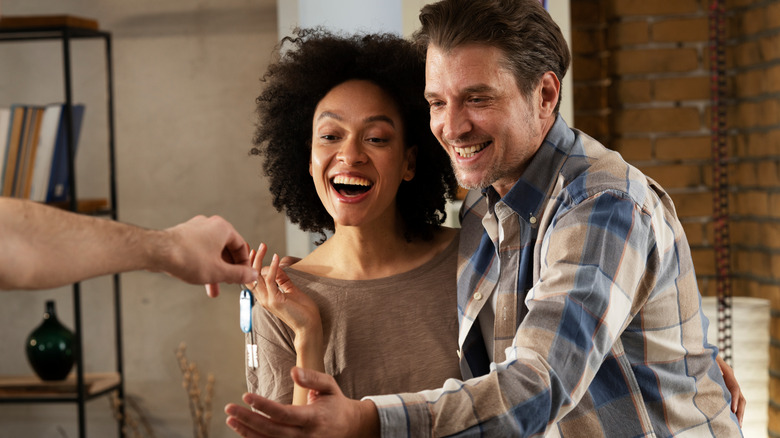 couple taking keys