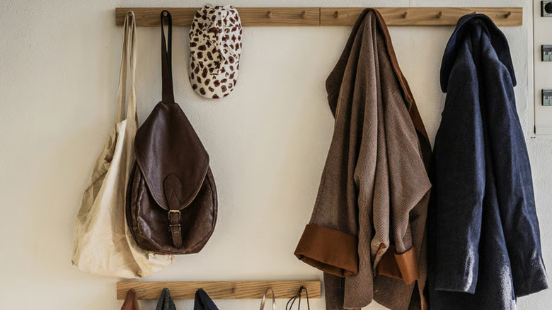 HÖVOLM coat rack holding bags and coats