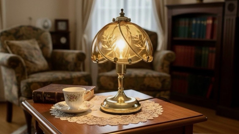 An ornate touch lamp in Hollywood Regency style