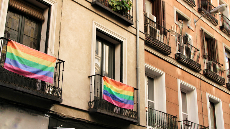 Pride flags hanging from balconies 