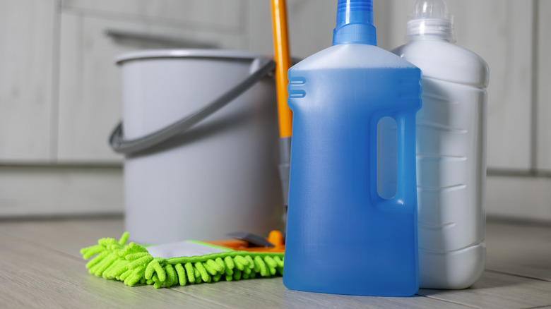 microfiber mop beside various cleaning products