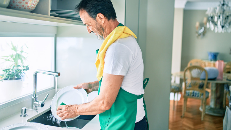 Person hand-washing dishes