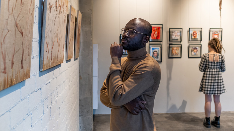 People looking at museum art