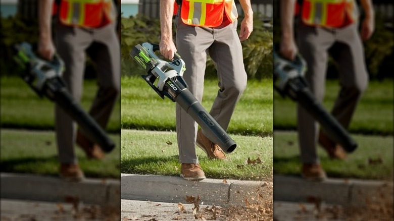 person using EGO blower