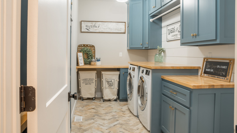 farmhouse laundry room with signs