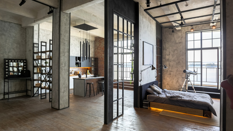 An industrial apartment with concrete walls and flooring