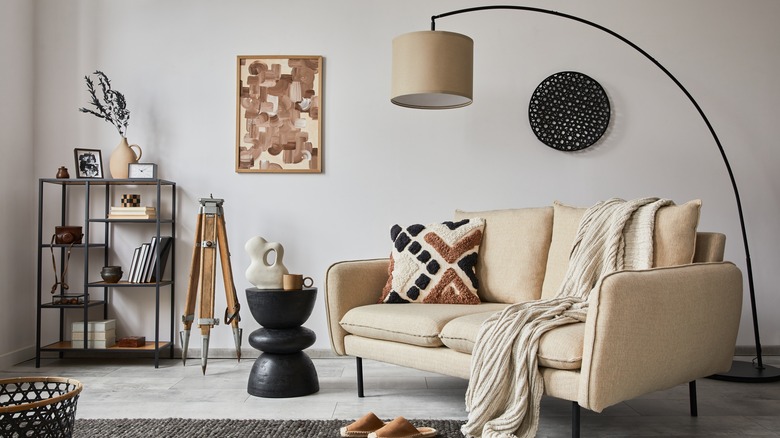 Beige couch surrounded by furnishings