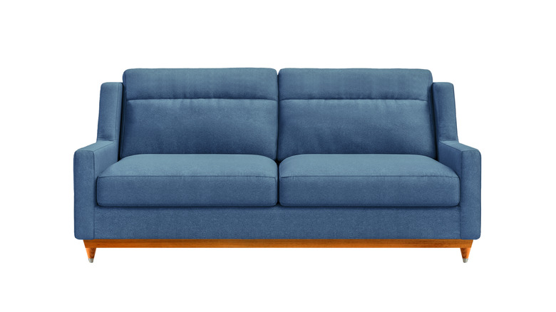 Blue couch against white background