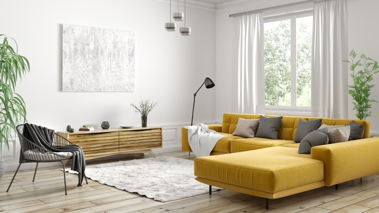 Yellow sofa in white room