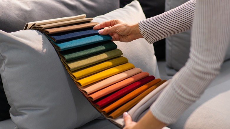 woman examining different color palettes 
