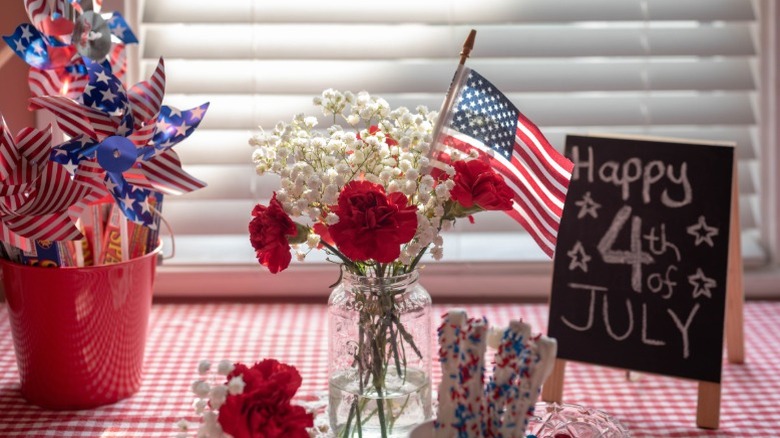 A mason jar used as a vase for flowers