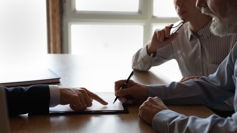 couple signing heloc contract