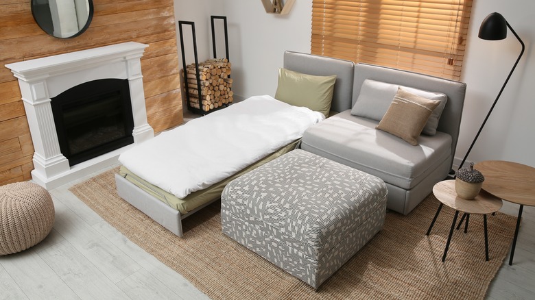 sleeper sofa next to fireplace
