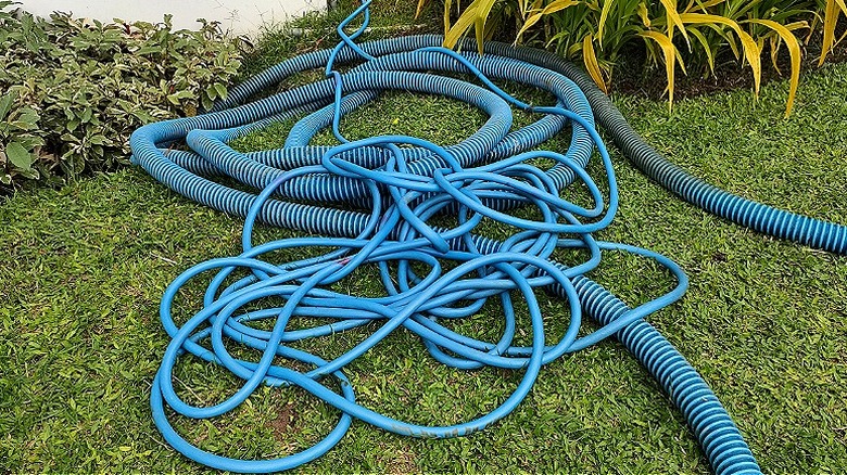 Coiled and twisted garden hoses