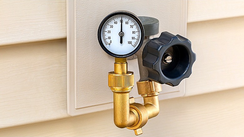 Water pressure gauge attached to spigot