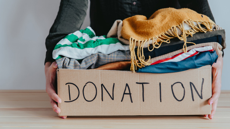 Person holding donation box