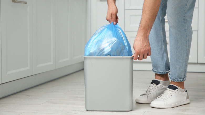 Person taking out recycling