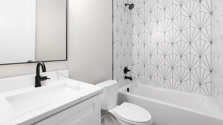 White bathroom with geometric shower