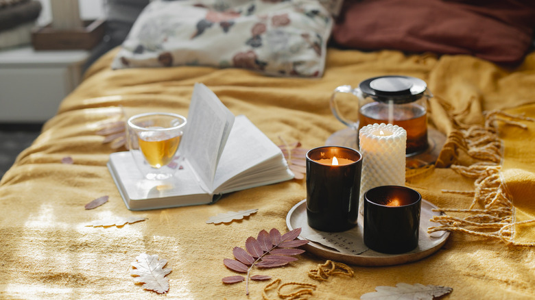 bed with books and candles