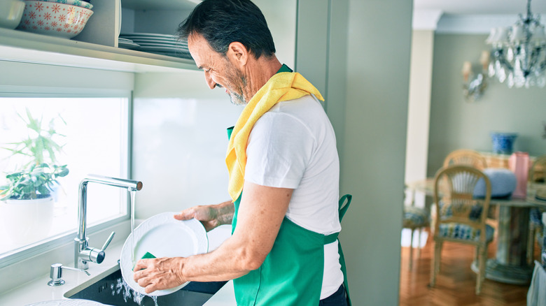 Person washing dishes 