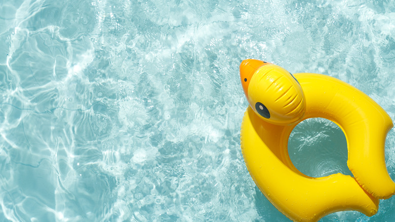 yellow duck toy in pool