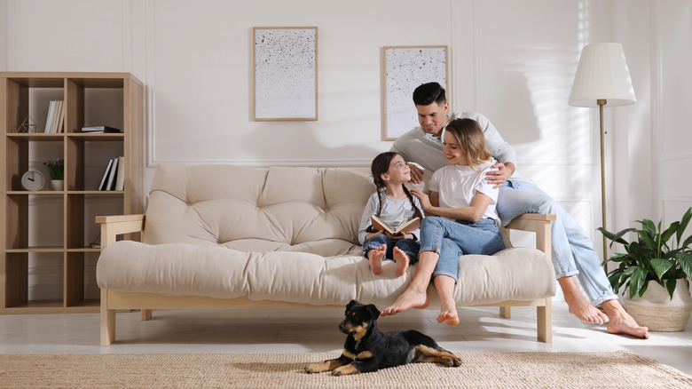 family sitting on couch