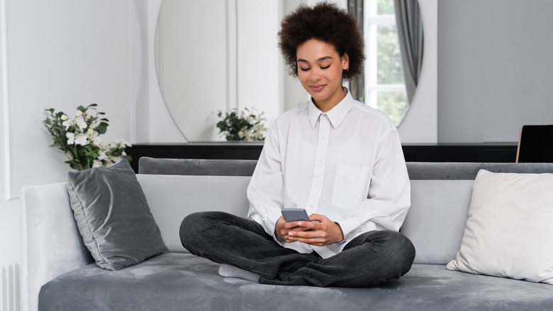 woman sitting on couch