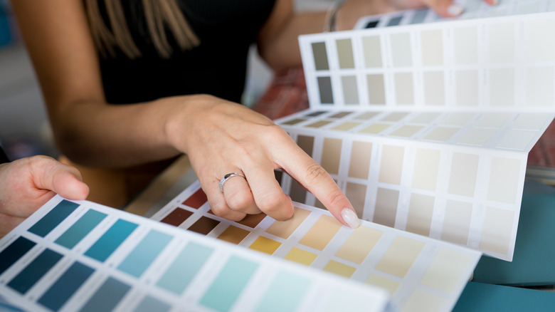 woman selecting paint color