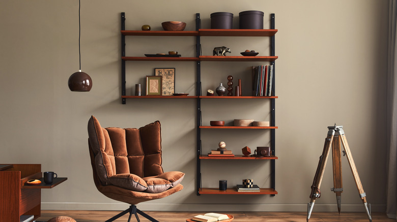 unique bookcase with brown chair