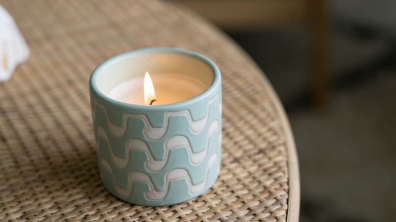 candle on rattan table