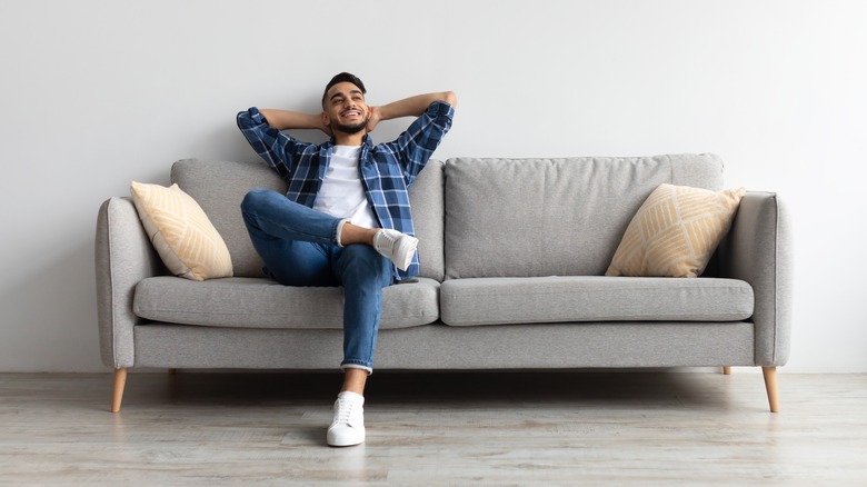 man sitting on couch