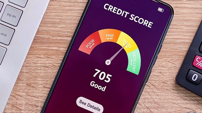 A smartphone screen showing a credit score of 705