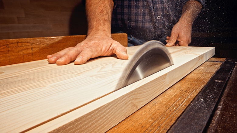 table saw cutting wood