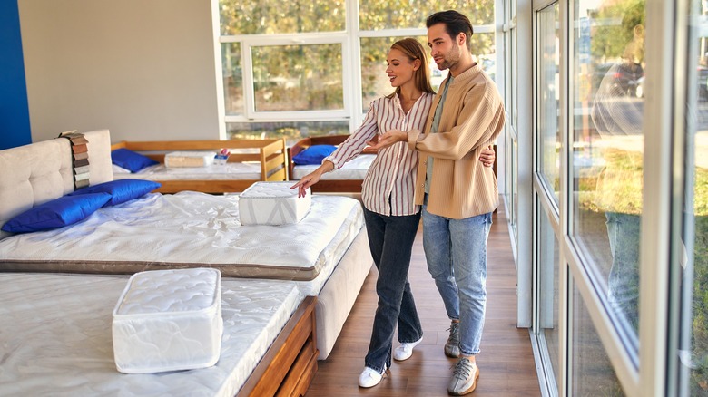 Couple buying mattress