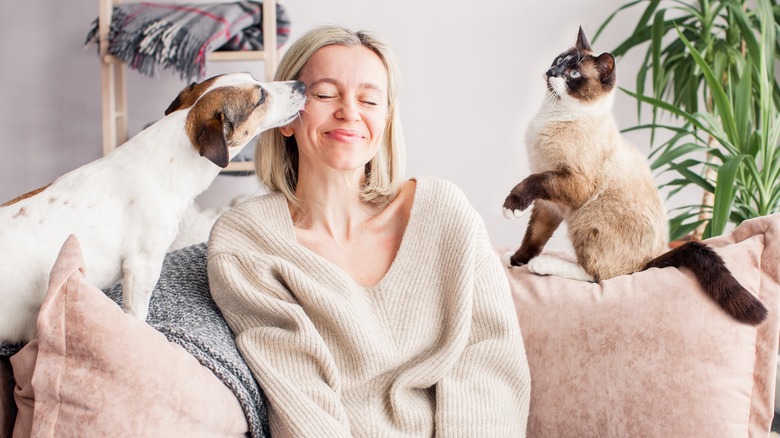 woman with dog and cat