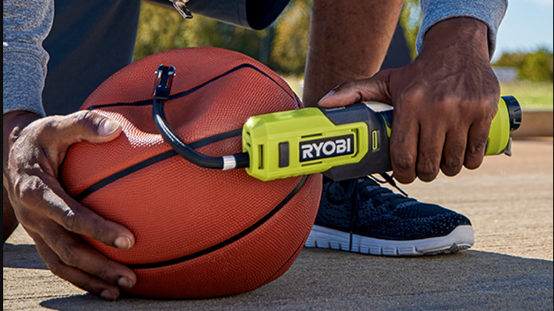 Man inflates basketball