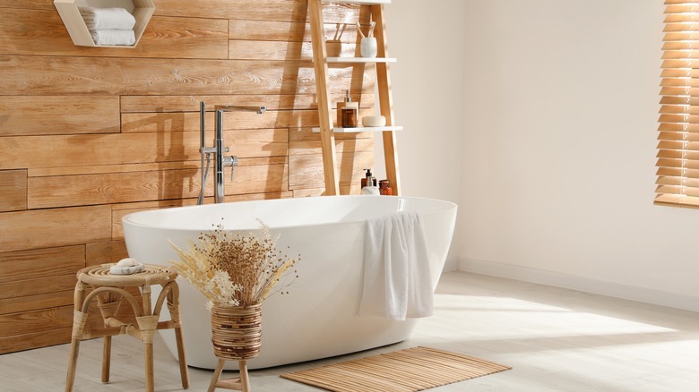 Freestanding bathtub in neutral bathroom