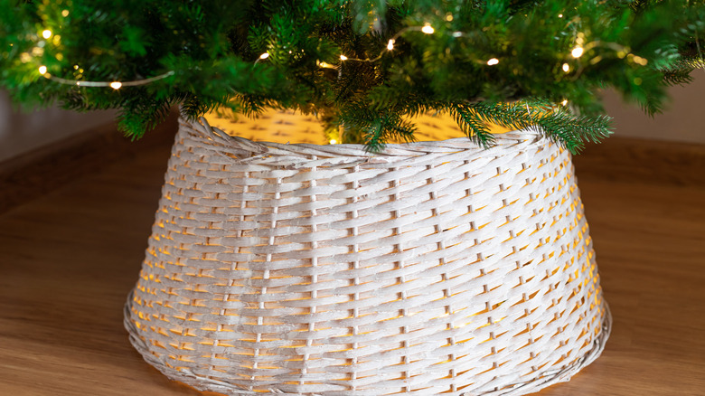 Decorative wicker Christmas tree collar under tree