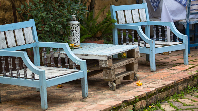 Brick patio with reclaimed wooden furniture