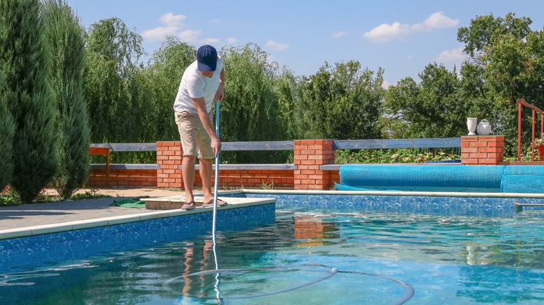 Person skimming pool