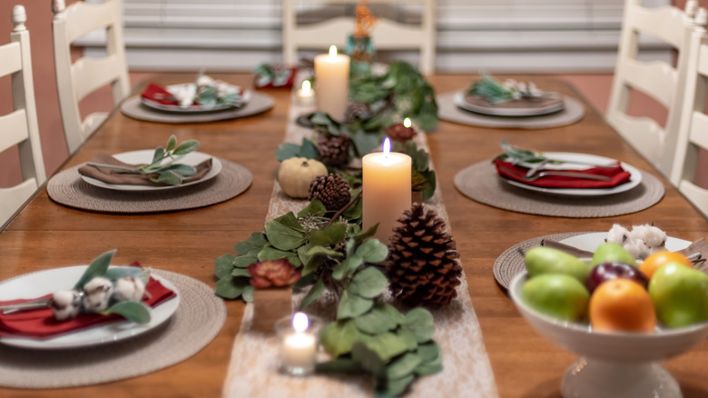 eucalyptus with pinecones and candles