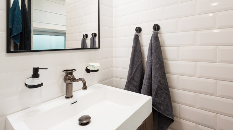 Bathroom sink with white tiles