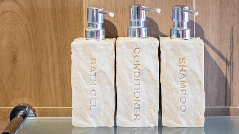 Matching toiletry bottles on shelf