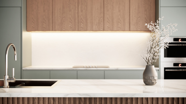 Flowers sitting atop kitchen counter